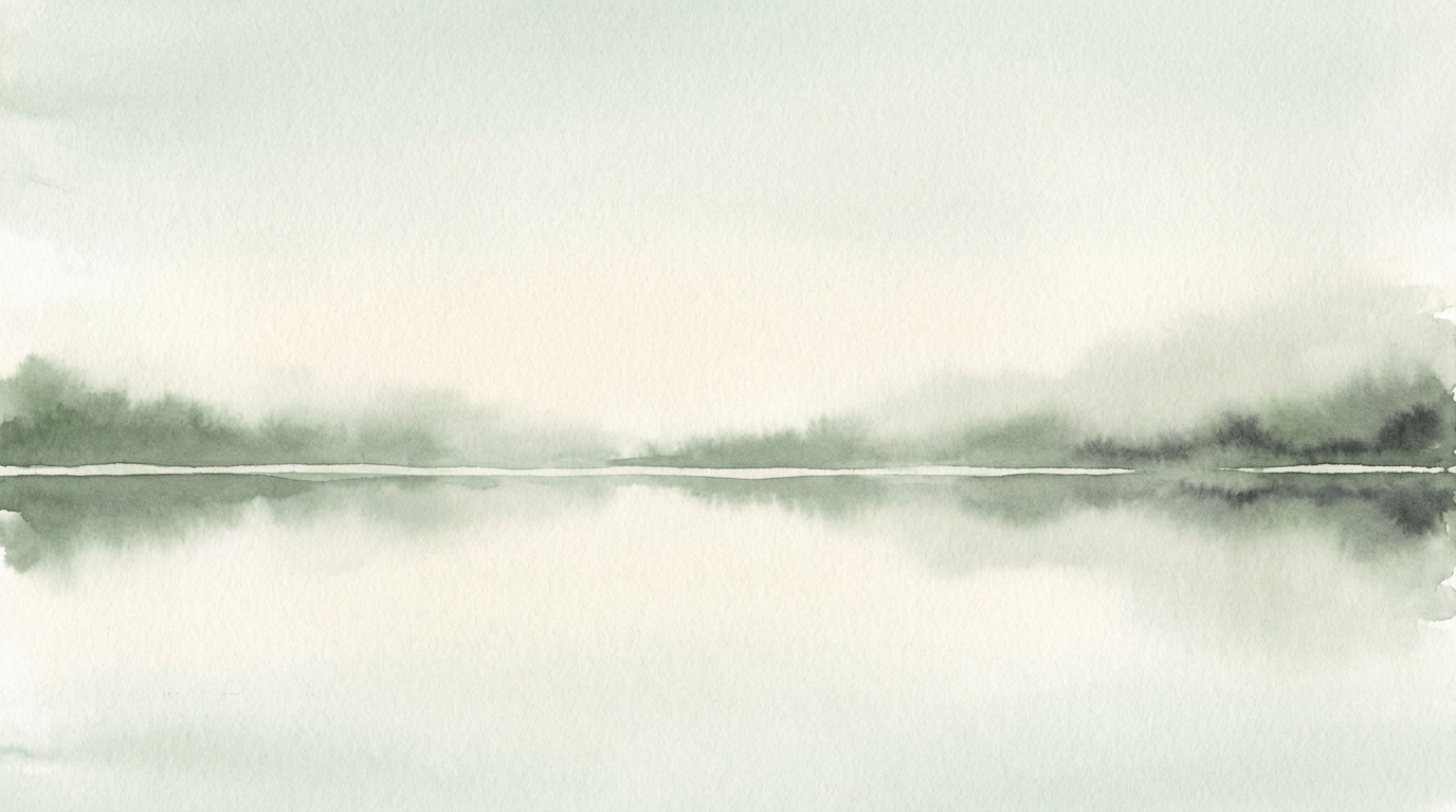 A still lake at dawn, a calm unbroken horizon