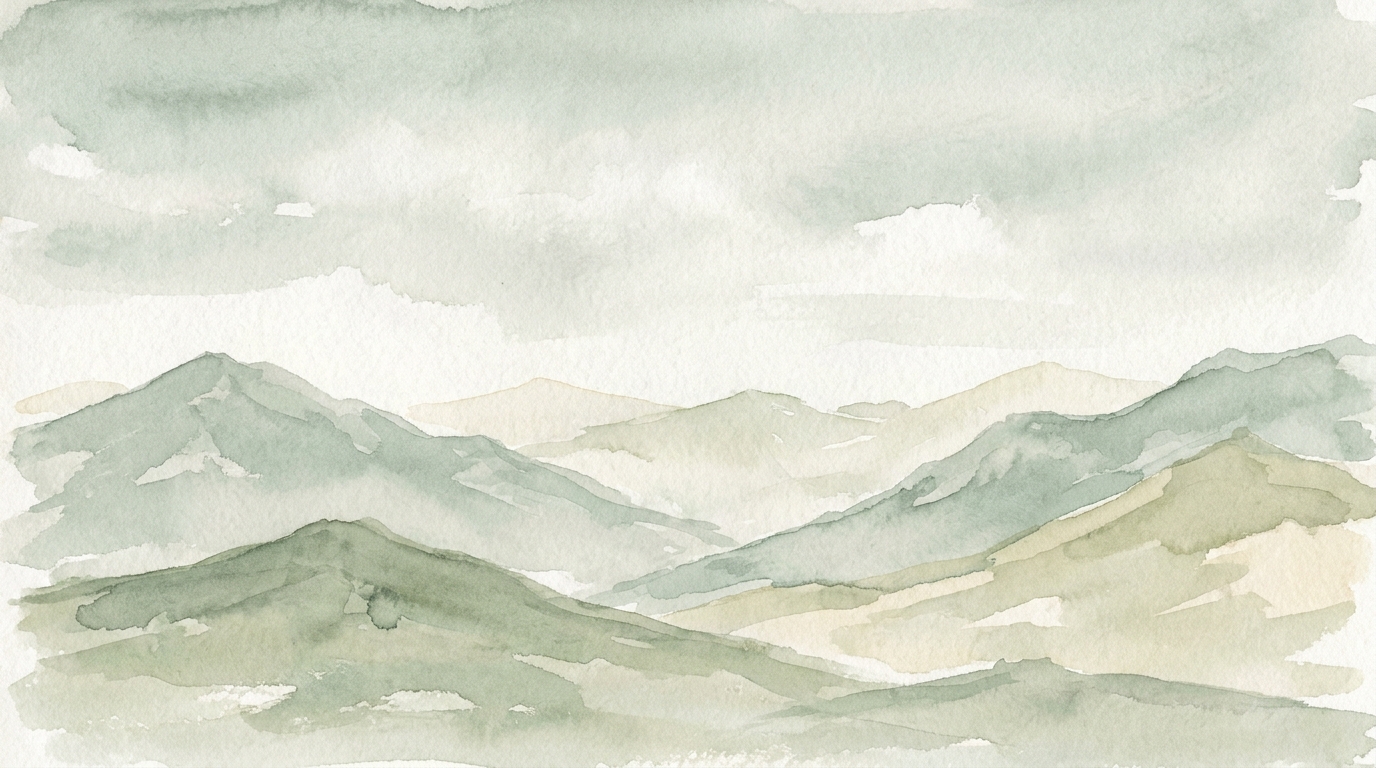 A wide mountain panorama at dawn